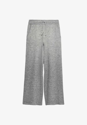 Pantalon large en maille gris clair avec taille élastique et cordon de serrage, doté de poches latérales.