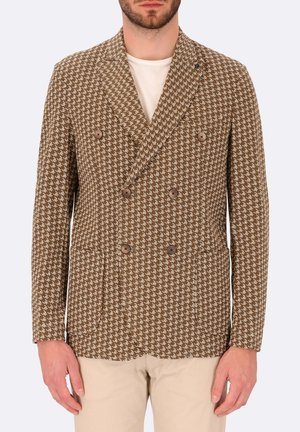 Blazer doppiopetto in motivo houndstooth marrone con due bottoni, rever a punta e tasche laterali. Realizzato in tessuto testurizzato.