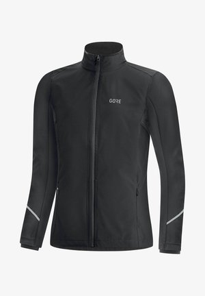 Schwarze Softshell-Jacke mit hohem Kragen, vorderem Reißverschluss, reflektierenden Akzenten an den Ärmeln und dem Logo "GORE" auf der Brust.