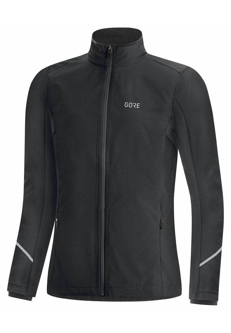 Black softshell jacket with a high collar, front zipper, reflective accents on sleeves, and the logo "GORE" on the chest.