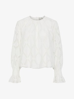 White blouse featuring a textured diamond pattern and puffed sleeves with smocked cuffs. Round neckline; lightweight, breathable fabric.