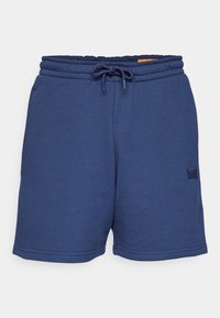 Shorts bleu marine en tissu doux, dotés d'une taille élastique avec cordon de serrage, de poches latérales et d'un petit logo cousu.