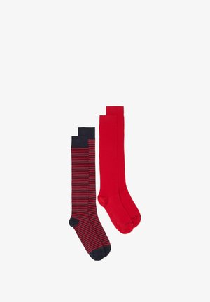 Two pairs of knee-high socks: one solid red and one with navy and red stripes. Both feature a smooth texture and finished cuffs.