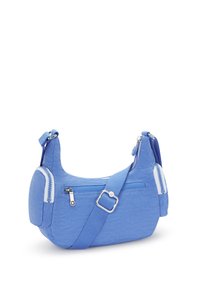 Blaue Stoff-Schultertasche mit runder Form, ausgestattet mit einem Reißverschluss-Hauptfach, einer Vorderseite und einem verstellbaren Trageriemen. Strukturierte Oberflächendetails.