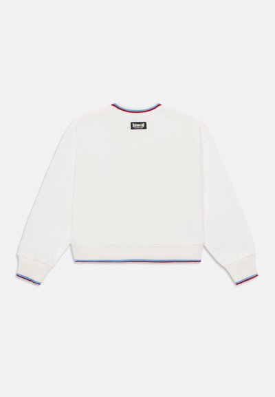 White sweatshirt with long sleeves, featuring colored ribbed accents in red, blue, and white at the collar and cuffs, with a label on the back.