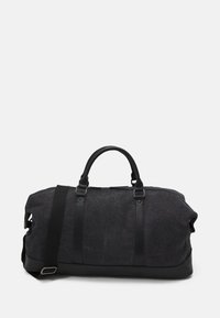 Sac de sport noir avec un dessus en tissu et un fond en simili cuir. Équipé de deux poignées et d'une bandoulière amovible. Fermeture éclair.