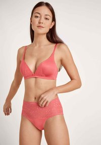 Pink lace-trimmed bralette with a smooth, seamless design. High-waisted matching panties feature a floral lace waistband and soft fabric.