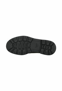 Suela de zapato de goma negra con surcos profundos, perforaciones circulares y texto "GEOX Patentado Italiano" sobre un fondo blanco.