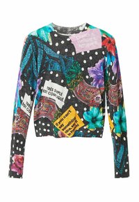 Sweat-shirt court multicolore avec un fond noir à pois blancs, motifs floraux et texte en plusieurs couleurs et styles.