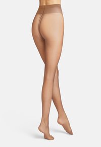 Genomskinliga, nakna strumpbyxor med en slät yta, hög midja och öppen gren-design. Materialet verkar vara lätt och elastiskt.