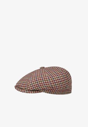 Flat cap with buttoned top, featuring red, brown, blue, and beige plaid pattern, shown from a side angle on white background.