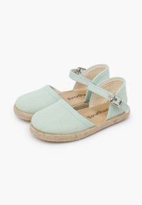 Heledad helesmint rohelised espadrillid kangast ülaservaga, jute köitest põhja ja reguleeritava rihmaga, millel on metallist klamber. Lame, ümar varvas.