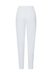 Vita, byxorna med elastisk midja och smalnande design. Tillverkade av mjukt tyg, med en slät yta och utan synliga mönster eller detaljer.