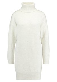 Lång vit stickad polotröja med ribbade muddar, fåll och hals, med en mjuk, mysig textur och avslappnad passform.