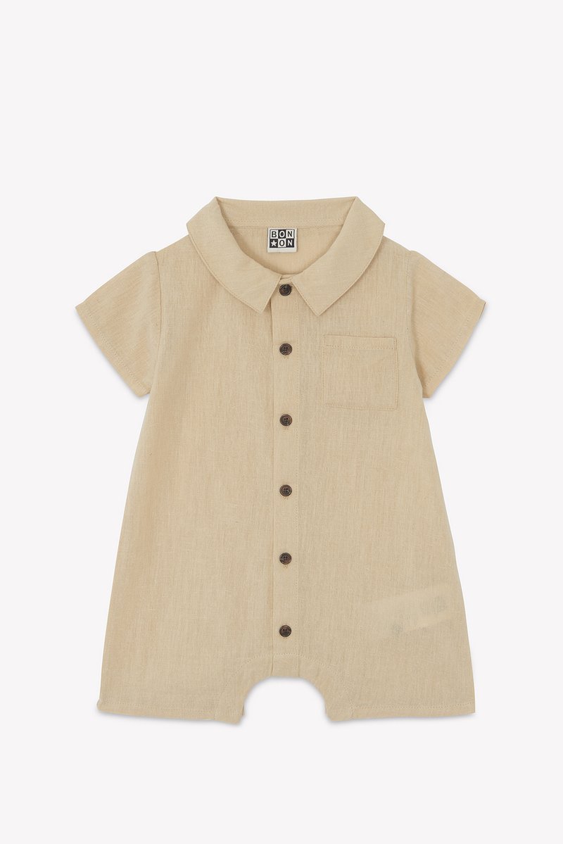 Beige short-sleeve romper with collared neck, six brown buttons, and a chest pocket. Made from a textured, lightweight fabric.