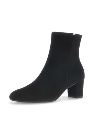 Black suede ankle boot with a pointed toe, covered block heel, and side zipper, featuring a smooth texture and minimalist design.