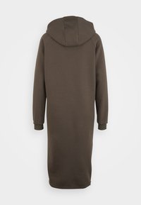 Hoodie i mörkbrun färg, knä-lång, tillverkad av mjukt tyg. Har långa ärmar med ribbade mudd och en något avslappnad passform.