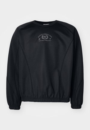 Must värvi dressipluus ümmarguse kaelusega, soonikuga mansetid ja hem. Rinnaosas on peen graafikatrükk ning kangas on sile, veidi tekstuuriga.