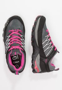 Gray and black hiking shoes with pink accents, featuring a mesh upper, textured side panels, rubber sole, and lace-up closure.