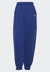 Blauwe katoenen sportbroeken met een elastische tailleband, cuffs bij de enkels, zijzakken en een klein gouden logo op de bovenste linker dij.