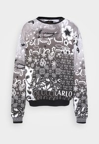 Černobílá mikina s propracovanými paisley a květinovými vzory, kulatým výstřihem, dlouhými rukávy a žebrovanými manžetami a lemem.