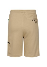 Beige shorts lavet af blødt stof med elastisk linning, sidelomme med sort kant og baglomme med klap.