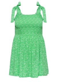 Vestido verde con estampado floral, cuerpo fruncido, lazos en los hombros y falda acampanada. Presenta pequeños patrones de flores blancas sobre un fondo verde brillante.