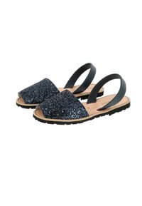 Glittery navy blue sandals with open toe and floral-patterned footbed, featuring black elastic band and textured sole for grip.