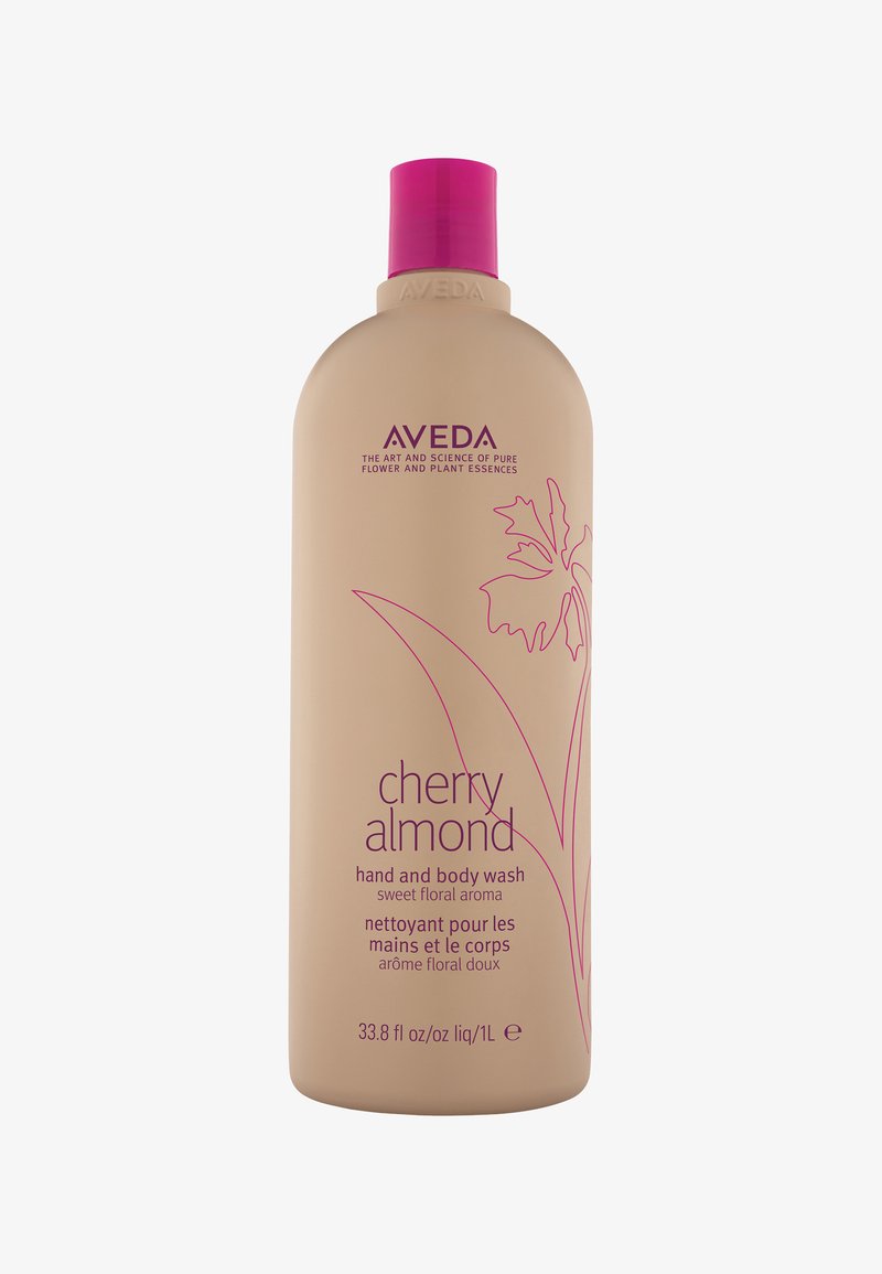 Bottiglia di bagnoschiuma per mani e corpo Aveda Cherry Almond, beige con design floreale rosa e testo, 1 litro, aroma floreale dolce.