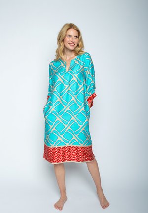 Leichtes türkisfarbenes Tunika mit geometrischem Muster in Creme, verziert mit einem roten, gemusterten Saum, V-Ausschnitt und seitlichen Taschen.