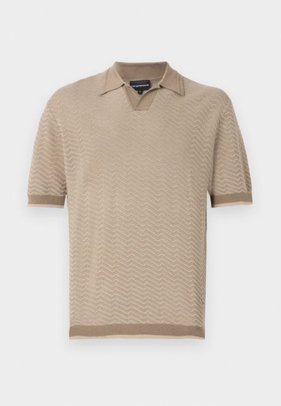 Beige short-sleeve polo shirt made of textured knit fabric featuring a zigzag pattern, with a classic collar and ribbed cuffs.