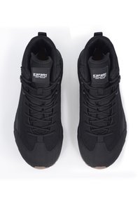 Black lace-up athletic shoes with a textured upper, cushioned collar, and a rubber sole. Features a logo tag on the tongue.