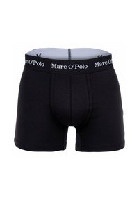 Boxer da uomo neri con un elastico marchiato che recita "Marc O'Polo", con dettagli di cucitura anteriore.