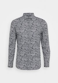 Pitkähihainen paita mustavalkoisella paisley-kuviolla. Siinä on kauluksellinen pääntie ja nappikoristeet. Valmistettu kevyestä kankaasta.