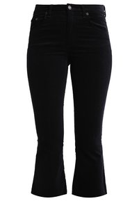 Jean flare en denim noir avec taille mi-haute, cinq poches et détails de boutons en métal. Le tissu a une finition lisse et légèrement texturée.