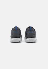 Gray athletic shoes with a mesh upper, contrasting blue accents, and a white rubber sole. Features a pull tab at the heel for easy wearing.