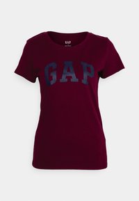 Burgundská bavlněná tričko s kulatým výstřihem a krátkým rukávem. Na přední straně se nachází výrazné námořnické logo "GAP".