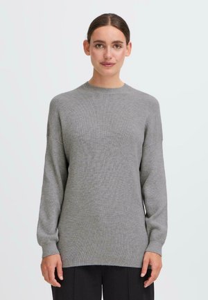 Light gray knitted sweater with a crew neck, dropped shoulders, and ribbed texture. Long sleeves extend to the wrist with a relaxed fit.