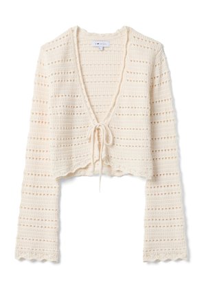 Cárdigan de punto de ganchillo color crema con mangas largas, abertura frontal, cierre con lazo y dobladillo y puños ondulados.