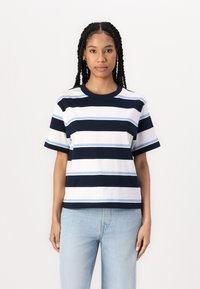 Cotton t-shirt featuring horizontal stripes in navy, light blue, and white, with a round neck and short sleeves, paired with light jeans.