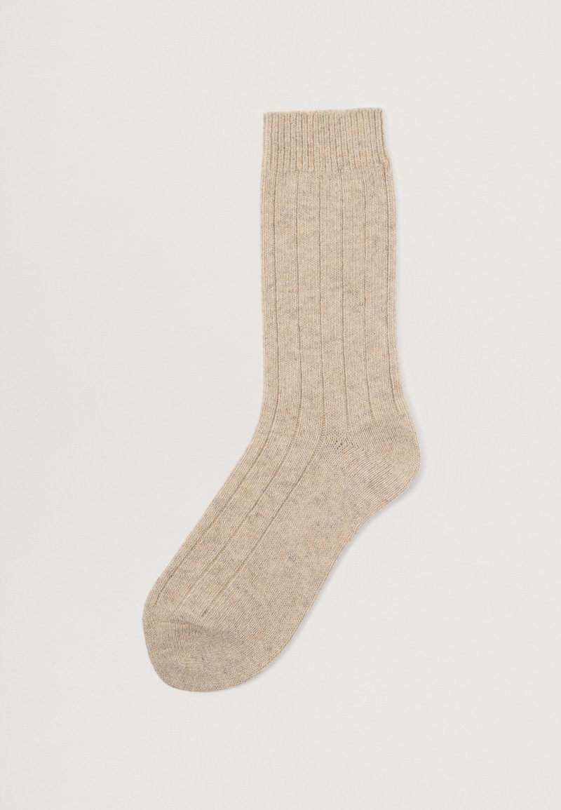 Beige geribbelde katoenen sok met een textuurafwerking en verstevigde hiel, met een omslagrand aan de bovenkant voor een veilige pasvorm.