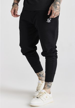 HAREM JOGGERS - Teplákové kalhoty - black