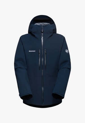 Marineblå udendørsjakke med hætte, frontlynlås, to brystlommer og Mammut-logo. Fremstillet af slidstærkt materiale med en glat tekstur.