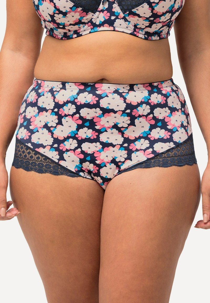 Slip a vita alta in blu navy con motivo floreale pastello, caratterizzato da dettagli in pizzo lungo i bordi per un tocco di texture e ricchezza.