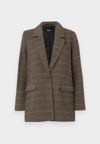 Brauner Fischgräten-Blazer mit Reverskragen, einreihigem Knopfverschluss, zwei vorderen Taschen und einem schwarzen Innenfutter. Dezente Karomusterakzente.