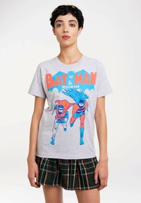 Gray cotton t-shirt featuring a blue and red graphic of Batman and Robin, with large text reading "BAT MAN & ROBIN" above them.