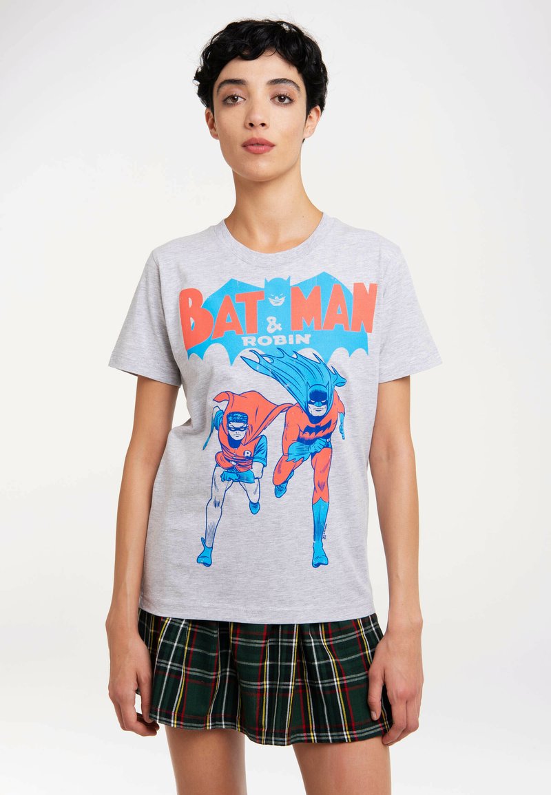 Gray cotton t-shirt featuring a blue and red graphic of Batman and Robin, with large text reading "BAT MAN & ROBIN" above them.