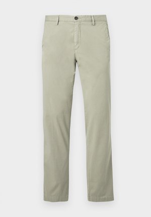 Gaiši zaļas šīnos bikses, izgatavotas no gludas kokvilnas auduma, ar pogu aizdari, sānu kabatām un taisnu kāju griezumu.