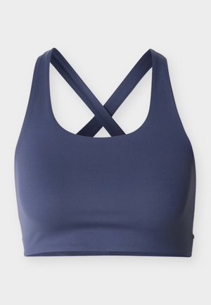 Sutien sport bleumarin cu bretele late care se încrucișează la spate, decolteu rotund și design fără cusături pentru suport sportiv.