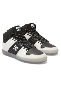 High-top sneakers featuring a black and white leather upper, textured surface, black laces with white accents, and a transparent sole.